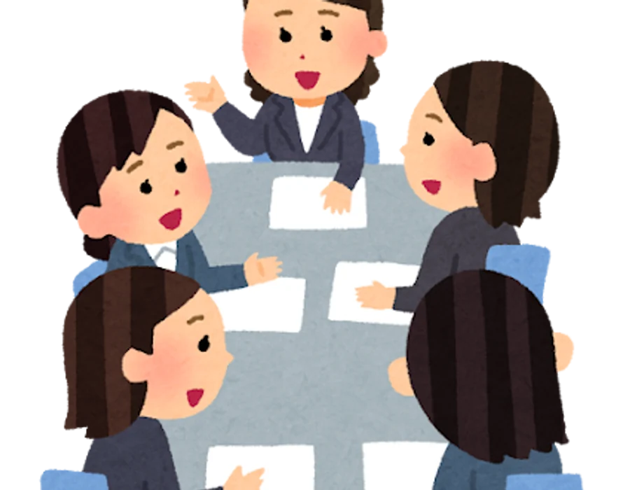 A group of students seated around a table in discussion